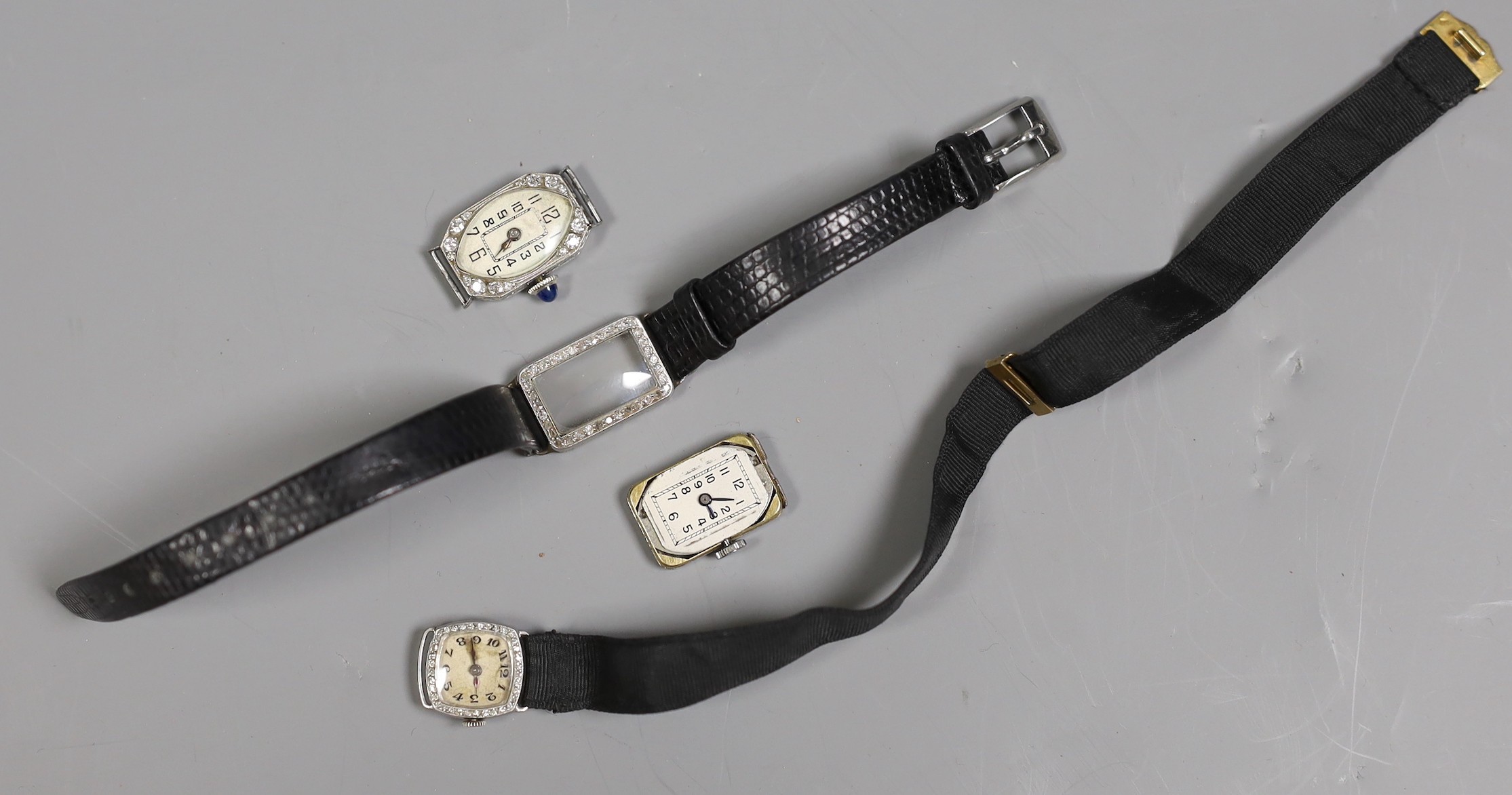 Three assorted mid 20th century white metal and diamond set manual wind cocktail watches, one stamped platinum, (a.f.).